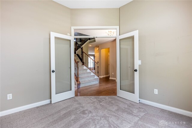 225 Woodstream Dr, Springboro, OH 45066 - carpeted spare room featuring french doors and stairs