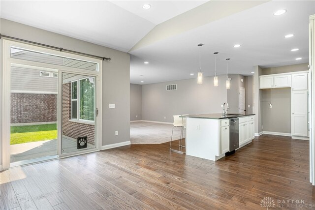 225 Woodstream Dr, Springboro, OH 45066 - kitchen featuring stainless steel dishwasher, dark wood-type flooring, open floor plan, white cabinetry, and pendant lighting