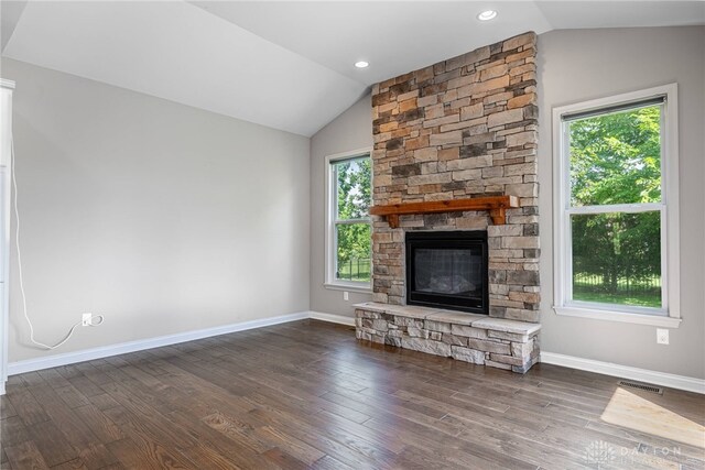 225 Woodstream Dr, Springboro, OH 45066 - unfurnished living room featuring lofted ceiling, plenty of natural light, a fireplace, and dark wood-style floors