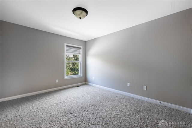 225 Woodstream Dr, Springboro, OH 45066 - spare room featuring baseboards and carpet flooring