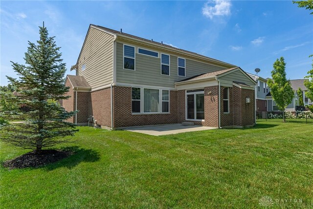 225 Woodstream Dr, Springboro, OH 45066 - back of house featuring a patio area and brick siding