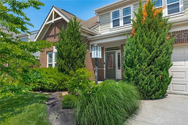 225 Woodstream Dr, Springboro, OH 45066 - view of property exterior featuring brick siding and a garage