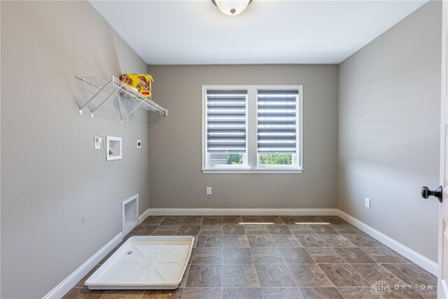 225 Woodstream Dr, Springboro, OH 45066 - laundry room featuring electric dryer hookup, washer hookup, and stone finish floors