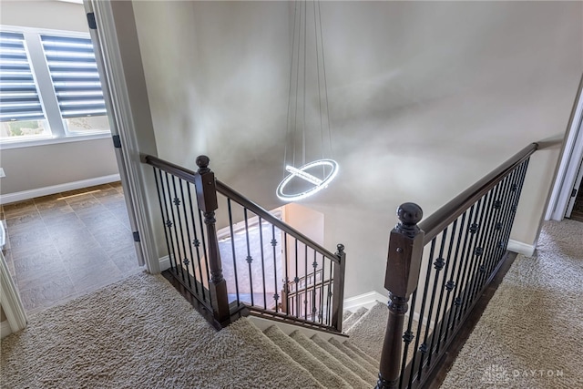 225 Woodstream Dr, Springboro, OH 45066 - stairs with a chandelier and baseboards