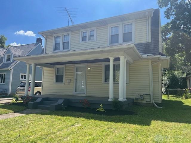 417 Sandalwood Dr, Dayton, OH 45405 - view of front facade featuring a porch and a front lawn