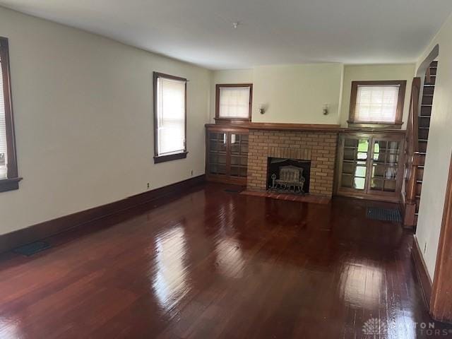 417 Sandalwood Dr, Dayton, OH 45405 - unfurnished living room featuring wood finished floors and a fireplace