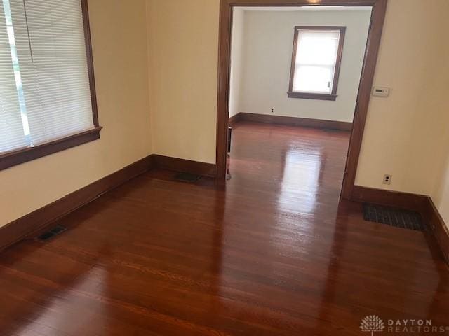 417 Sandalwood Dr, Dayton, OH 45405 - empty room with dark wood-style flooring and baseboards