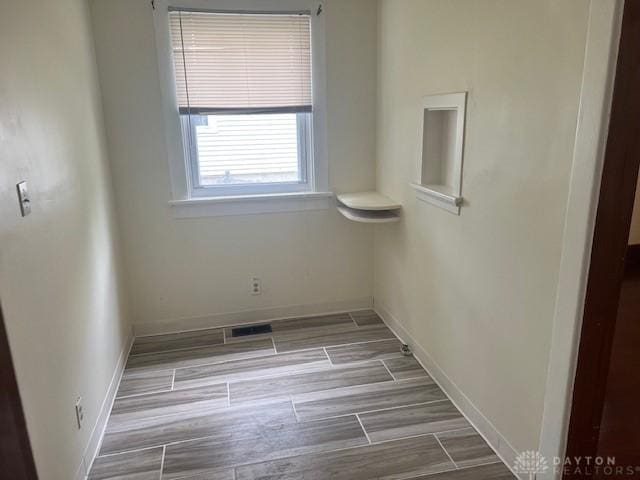 417 Sandalwood Dr, Dayton, OH 45405 - unfurnished room with baseboards and wood tiled floors