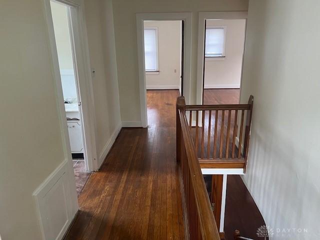 417 Sandalwood Dr, Dayton, OH 45405 - hallway with an upstairs landing and dark wood-type flooring