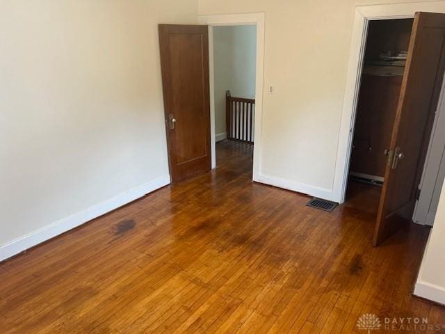 417 Sandalwood Dr, Dayton, OH 45405 - unfurnished bedroom with hardwood / wood-style flooring and a closet