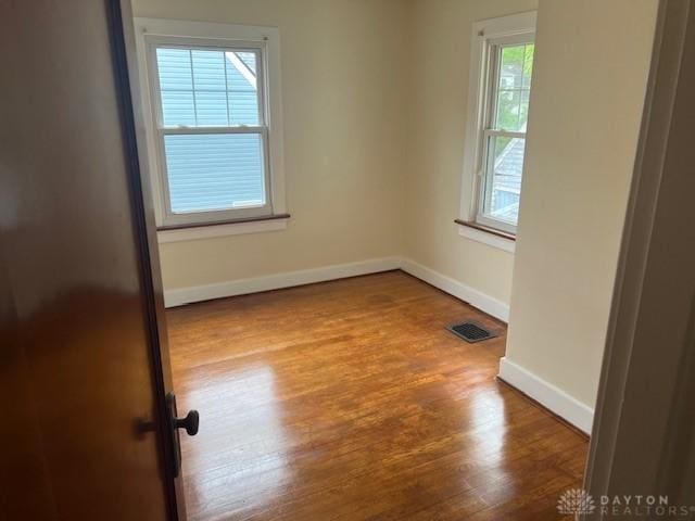 417 Sandalwood Dr, Dayton, OH 45405 - unfurnished room featuring wood finished floors and baseboards