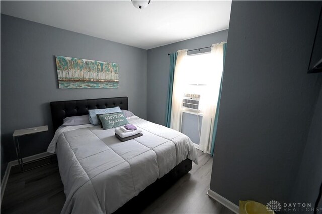 228 E Bruce Ave, Dayton, OH 45405 - bedroom featuring wood finished floors and cooling unit