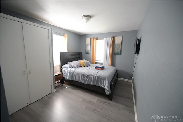 228 E Bruce Ave, Dayton, OH 45405 - bedroom with wood finished floors and baseboards