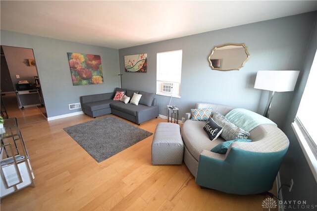 228 E Bruce Ave, Dayton, OH 45405 - living room featuring wood finished floors and cooling unit
