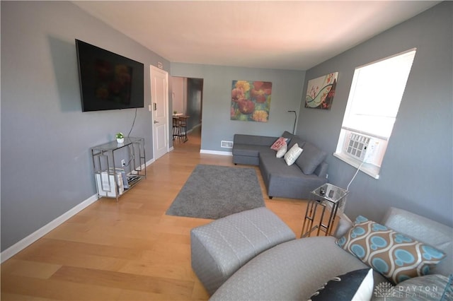 228 E Bruce Ave, Dayton, OH 45405 - living area with light wood-type flooring and cooling unit