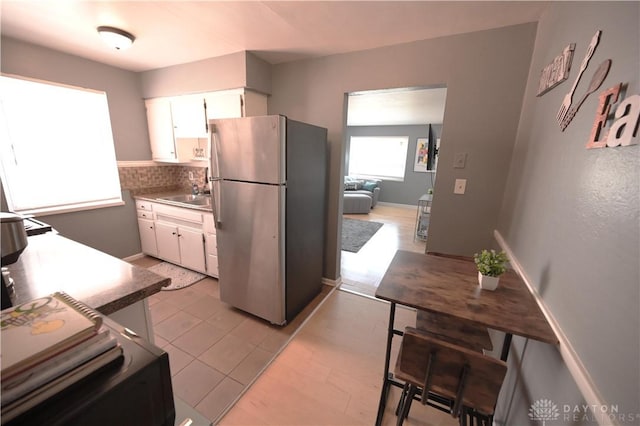 228 E Bruce Ave, Dayton, OH 45405 - kitchen featuring freestanding refrigerator and white cabinets