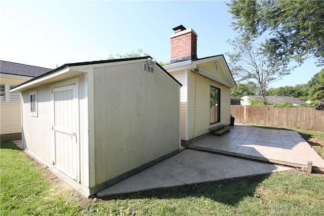 412 Cedar Ln, Lebanon, OH 45036 - view of side of home with a chimney, a patio, and a shed