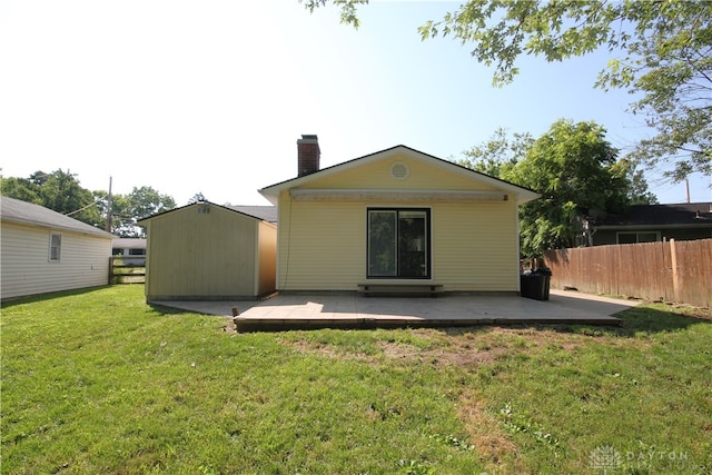 412 Cedar Ln, Lebanon, OH 45036 - rear view of house with a chimney, a shed, and a patio