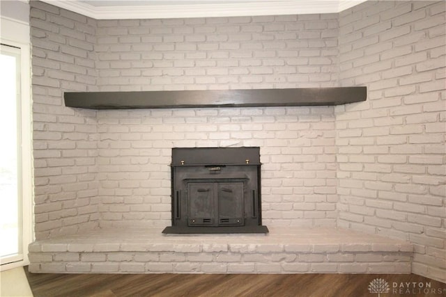 412 Cedar Ln, Lebanon, OH 45036 - detailed view of wood finished floors, brick wall, and ornamental molding