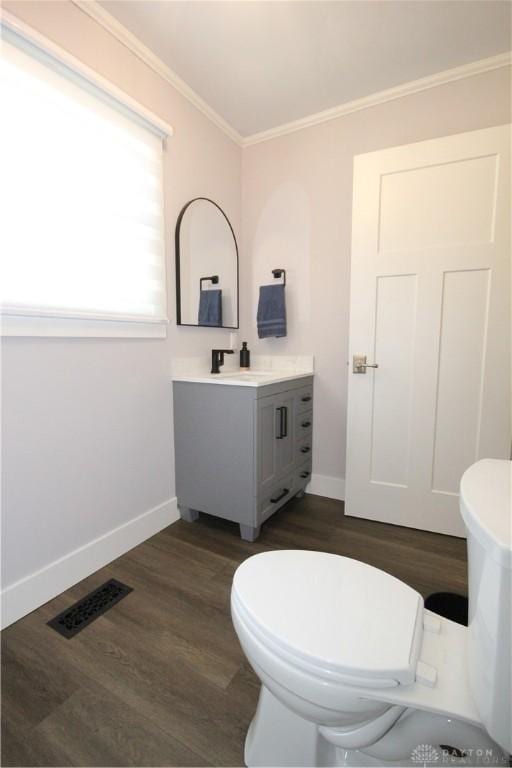 412 Cedar Ln, Lebanon, OH 45036 - half bathroom featuring vanity, crown molding, and wood finished floors