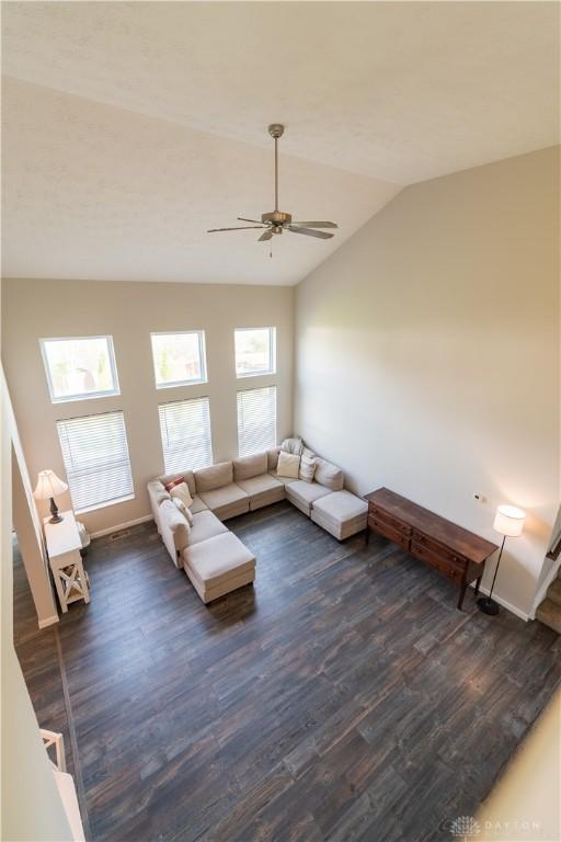 4005 Clearstream Way, Englewood, OH 45322 - living room featuring dark wood-style flooring, ceiling fan, and lofted ceiling