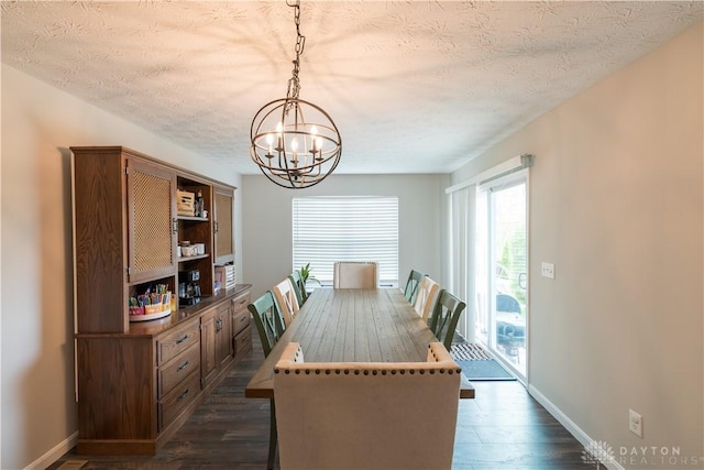 4005 Clearstream Way, Englewood, OH 45322 - dining area with a chandelier, dark wood finished floors, and a textured ceiling