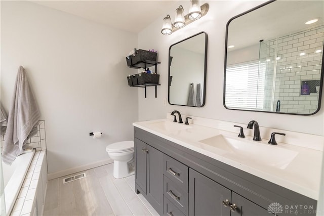 4005 Clearstream Way, Englewood, OH 45322 - bathroom with double vanity, a tile shower, and a relaxing tiled tub