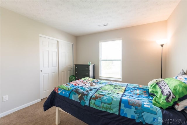 4005 Clearstream Way, Englewood, OH 45322 - carpeted bedroom with a closet and a textured ceiling
