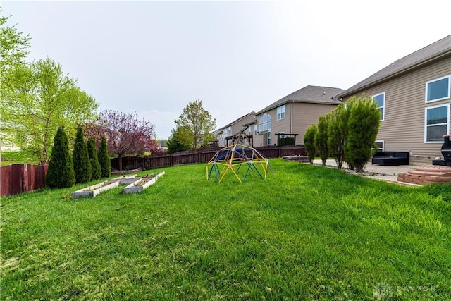 4005 Clearstream Way, Englewood, OH 45322 - fenced backyard with a garden, a playground, and a patio area