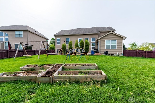 4005 Clearstream Way, Englewood, OH 45322 - back of property with a vegetable garden and a fenced backyard