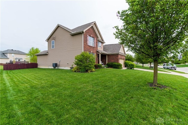 4005 Clearstream Way, Englewood, OH 45322 - view of property exterior featuring brick siding and a garage