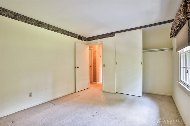 798 Carini Ln, Cincinnati, OH 45218 - unfurnished bedroom with a closet and light colored carpet