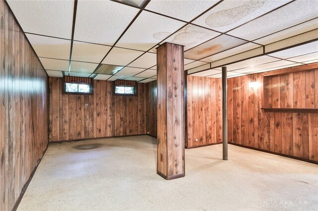 798 Carini Ln, Cincinnati, OH 45218 - below grade area featuring a paneled ceiling, wooden walls, and carpet flooring