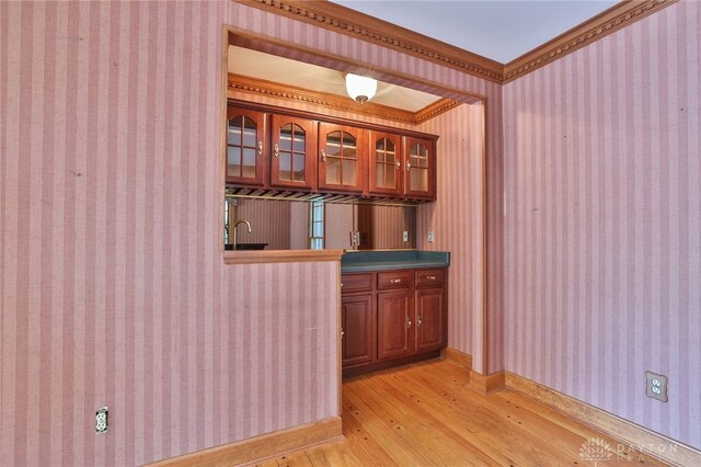 798 Carini Ln, Cincinnati, OH 45218 - indoor wet bar featuring wallpapered walls, light wood-style flooring, and crown molding