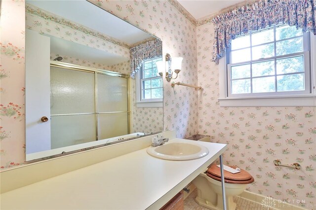 798 Carini Ln, Cincinnati, OH 45218 - bathroom featuring a shower with shower door, vanity, and wallpapered walls