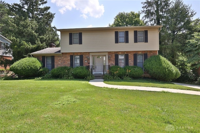 798 Carini Ln, Cincinnati, OH 45218 - view of front of property featuring brick siding and a front lawn