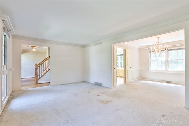798 Carini Ln, Cincinnati, OH 45218 - empty room featuring stairway, a chandelier, and carpet floors