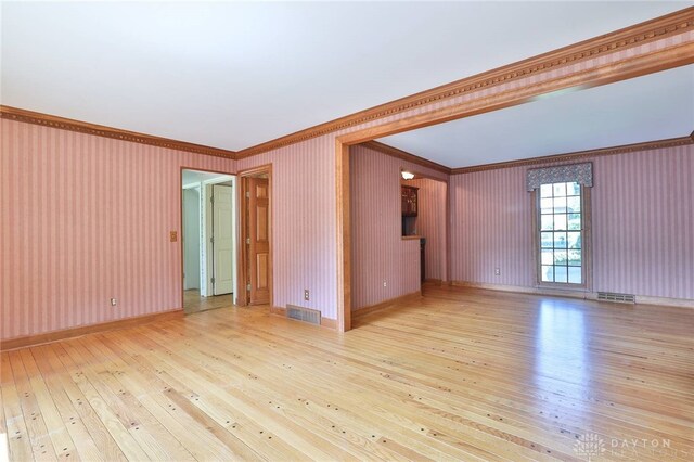 798 Carini Ln, Cincinnati, OH 45218 - spare room with ornamental molding and light wood-type flooring