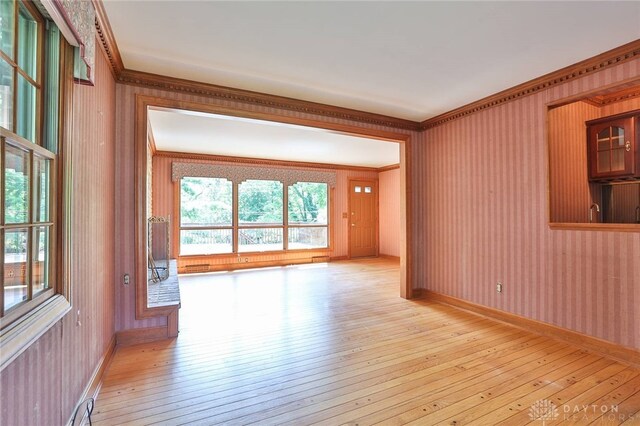 798 Carini Ln, Cincinnati, OH 45218 - empty room with light wood finished floors and ornamental molding