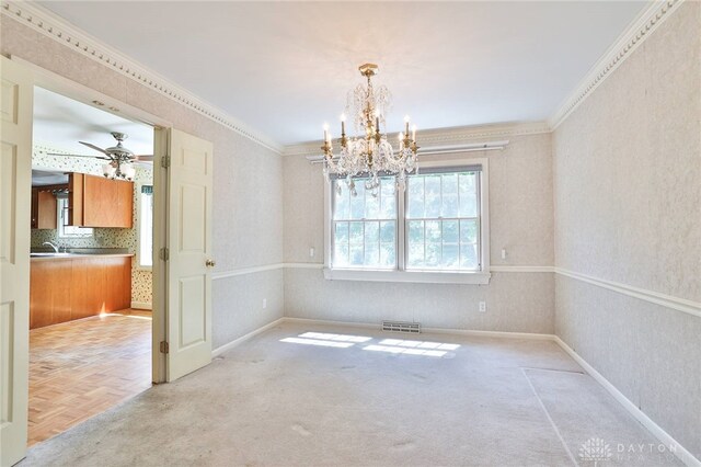 798 Carini Ln, Cincinnati, OH 45218 - unfurnished dining area with a chandelier, wallpapered walls, crown molding, and a ceiling fan