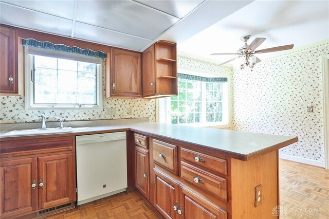 798 Carini Ln, Cincinnati, OH 45218 - kitchen with white dishwasher, wallpapered walls, a peninsula, healthy amount of natural light, and ceiling fan