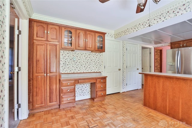 798 Carini Ln, Cincinnati, OH 45218 - kitchen with stainless steel refrigerator with ice dispenser, ceiling fan, brown cabinets, glass insert cabinets, and wallpapered walls