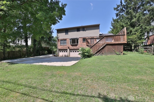 798 Carini Ln, Cincinnati, OH 45218 - back of property with stairway, a garage, a deck, driveway, and brick siding