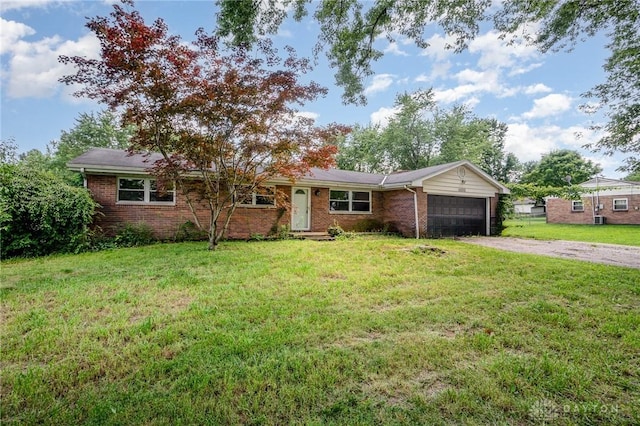 4689 Fisher Rd, Franklin, OH 45005 - ranch-style home featuring a garage, driveway, brick siding, and a front yard