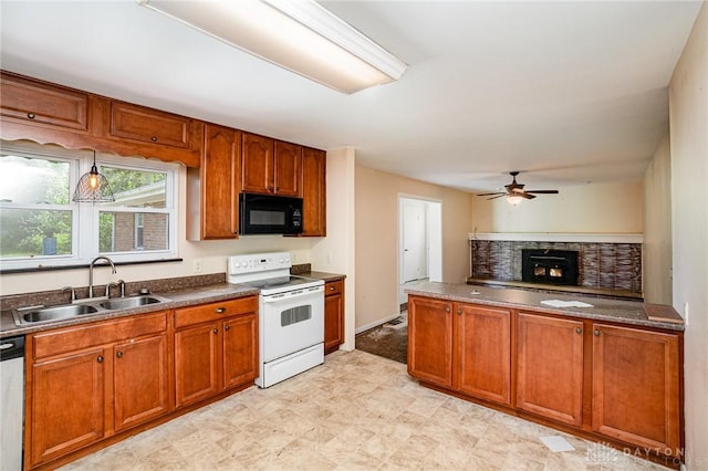 4689 Fisher Rd, Franklin, OH 45005 - kitchen with white range with electric stovetop, black microwave, a ceiling fan, a lit fireplace, and dark countertops