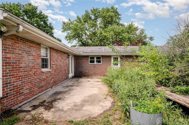 4689 Fisher Rd, Franklin, OH 45005 - view of property exterior featuring brick siding and a patio area
