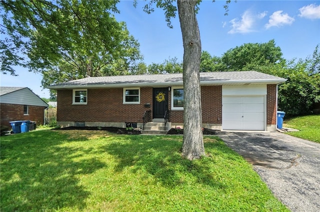 1378 Standish Ave, Riverside, OH 45432 - ranch-style house with an attached garage, driveway, a front yard, and brick siding