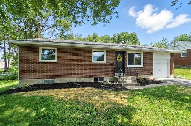 1378 Standish Ave, Riverside, OH 45432 - view of front facade with an attached garage, a front yard, and brick siding