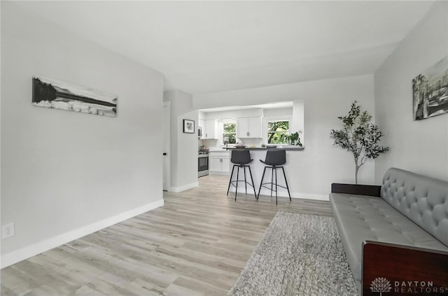 1378 Standish Ave, Riverside, OH 45432 - living area featuring light wood-type flooring and baseboards