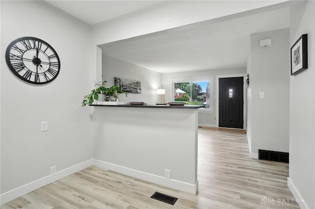 1378 Standish Ave, Riverside, OH 45432 - kitchen with light wood-style flooring, a peninsula, and dark countertops
